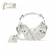 BALENCIAGA Le Cagole XS studded crinkled-leather shoulder bag White
